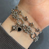 Spike cross heart piercing bracelet