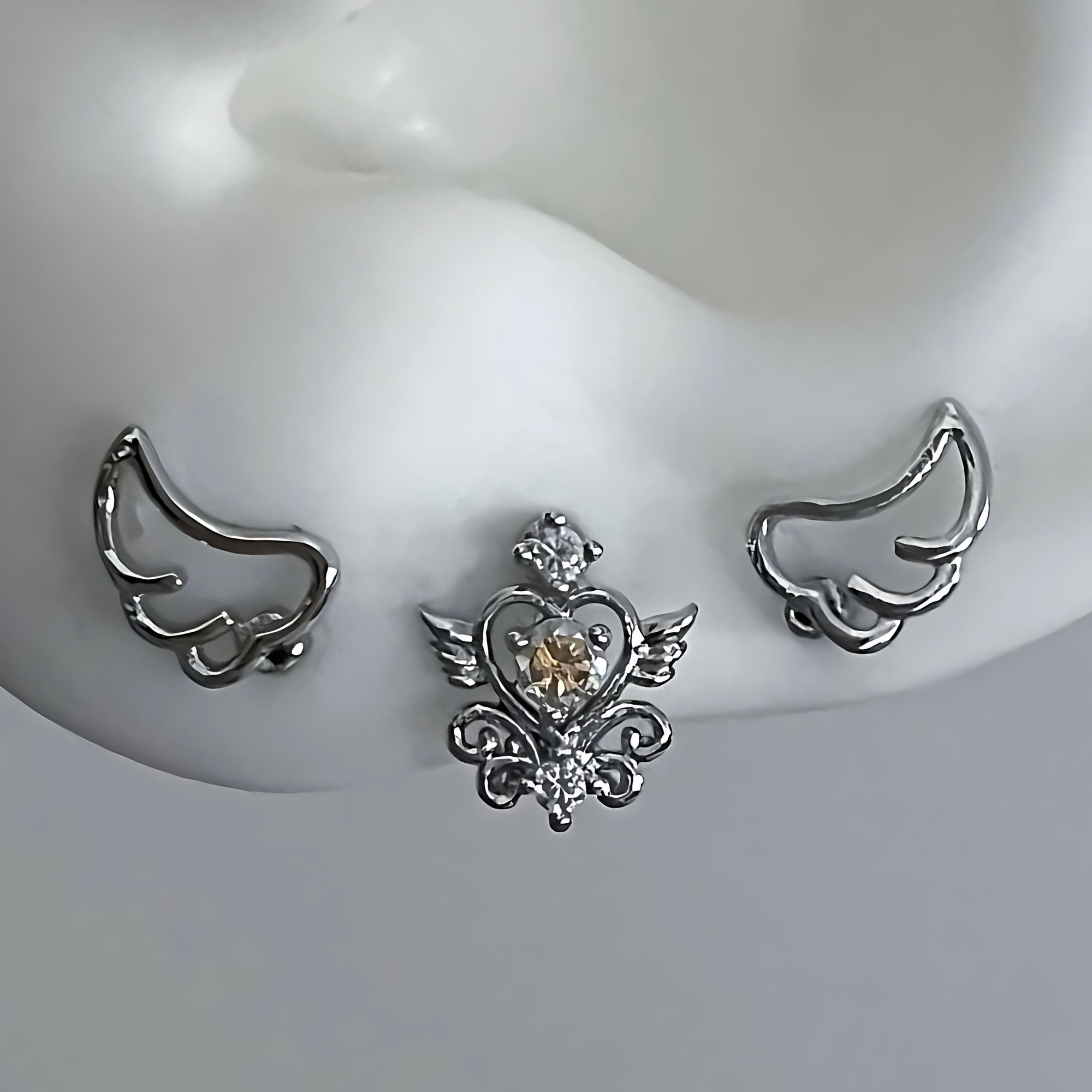 Dual wing heart piercing – TOOFOOFEEFA