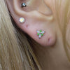 Green symbol piercing