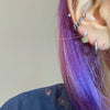 Green angel heart piercing