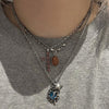 Blue swirl star necklace